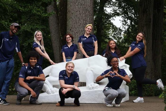 Peer counselors around the lion shrine