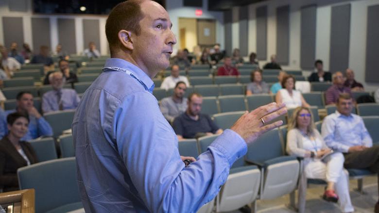 Andrew Muirhead presents his talk to faculty and staff